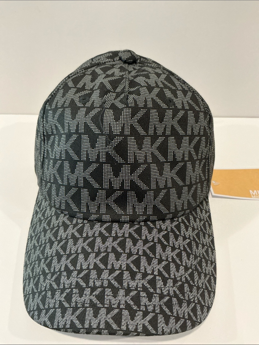 NWT Michael Kors Signature Monogram fabric gray/black cap with adjustable back.